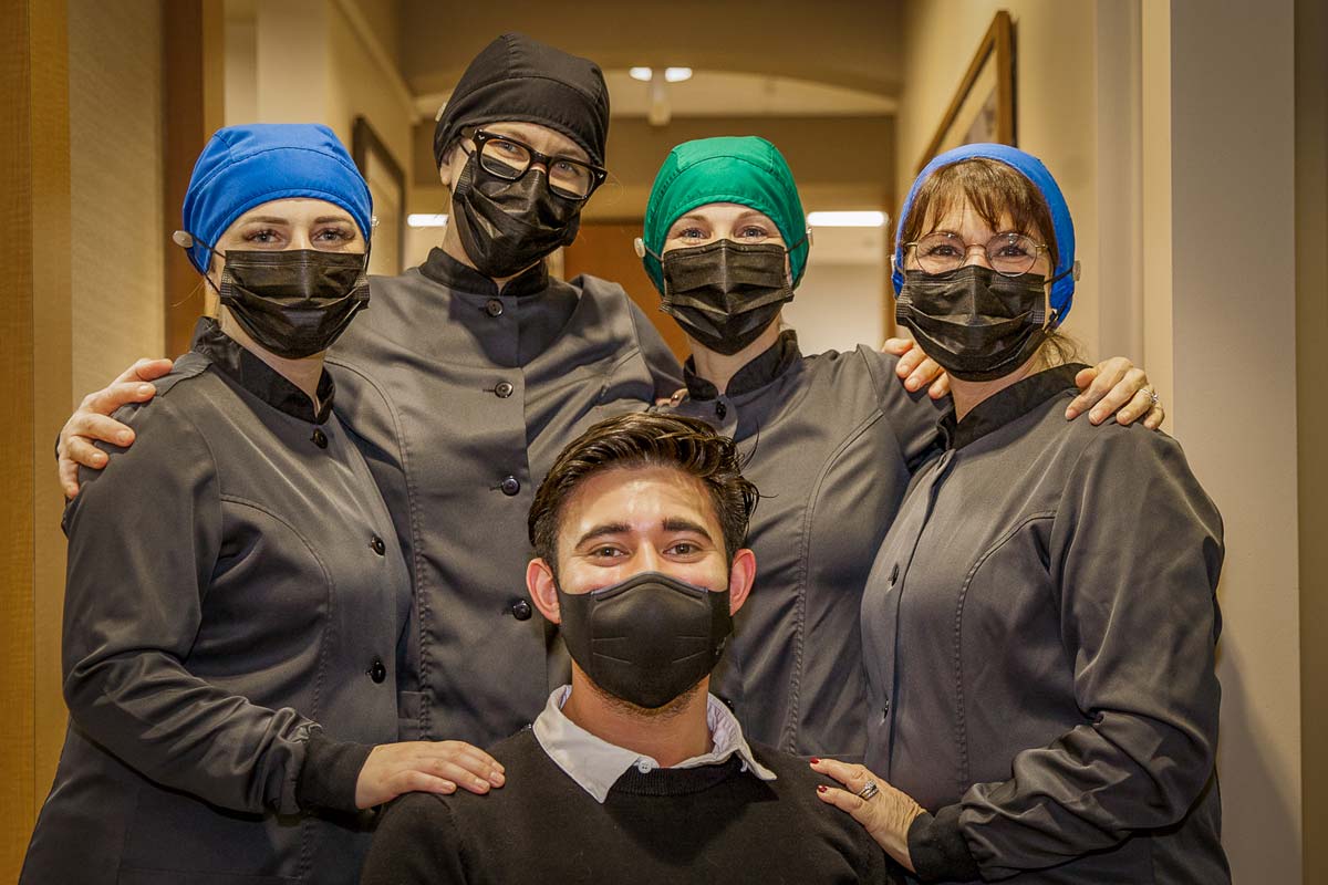 Dr. Jessica Emard and team group photo with masks on.